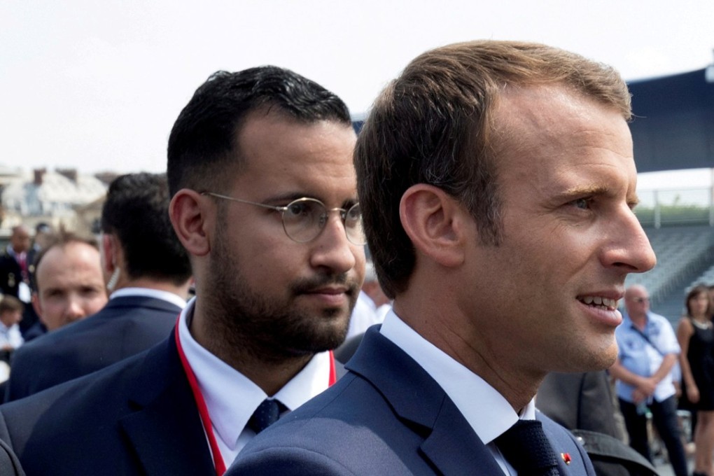 French President Emmanuel Macron (right) and his aide Alexandre Benalla at the Bastille Day military parade in Paris on July 14. Benalla has since been dismissed. Photo: Reuters