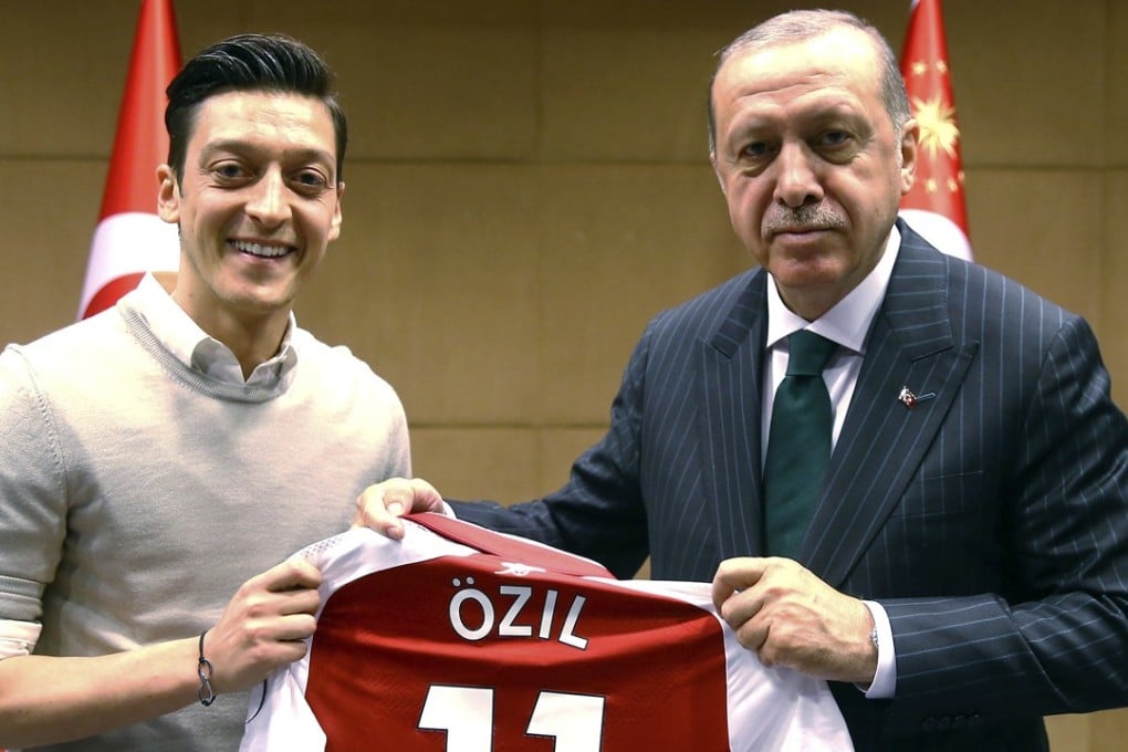 Turkey’s President Recep Tayyip Erdogan poses for a photo with Arsenal’s Mesut Ozil in London. Germany midfielder Ozil has announced his retirement from international football, claiming racial discrimination. Photo: AP