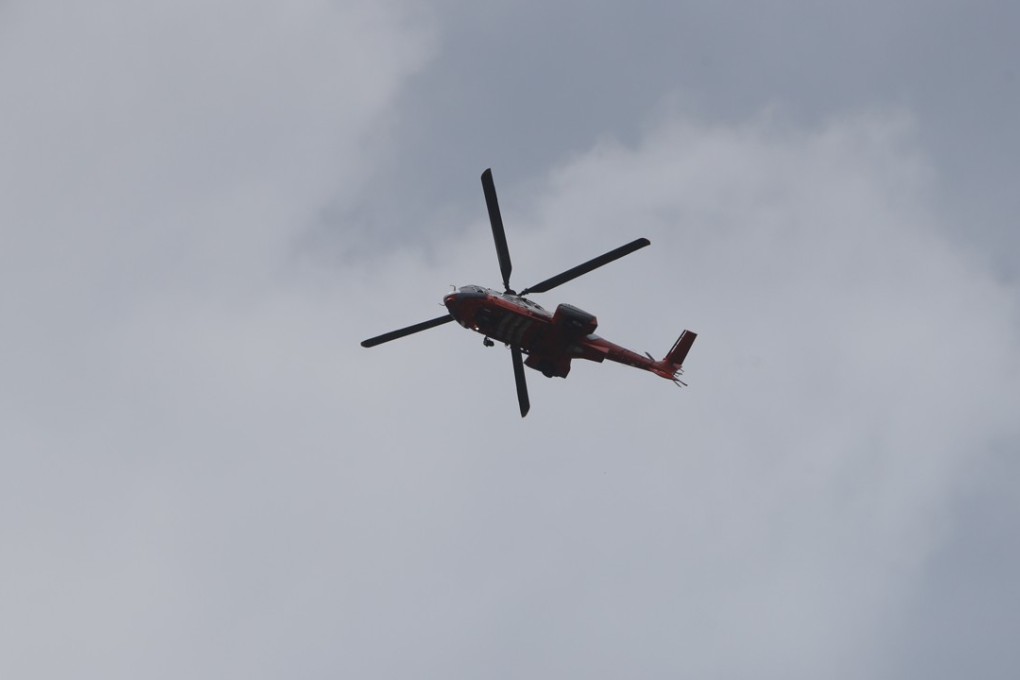 A fire department helicopter searches for Patrick Chung over Lantau Island on Tuesday. Photo: Winson Wong