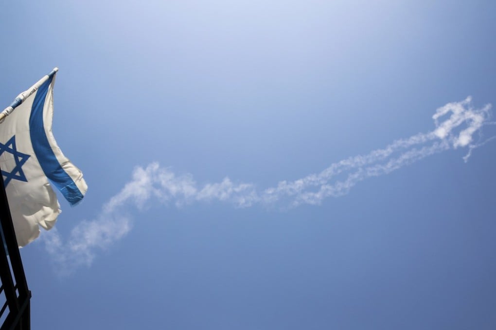 Trails of Patriot missiles are seen in the sky in northern Israel on Tuesday. Photo: Flash90 via AP