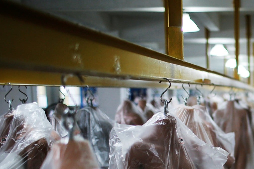 Sex dolls with different shapes and skin colours hang in a warehouse at the WMDOLL factory in Zhongshan, Guangdong province, China. Photo: Reuters