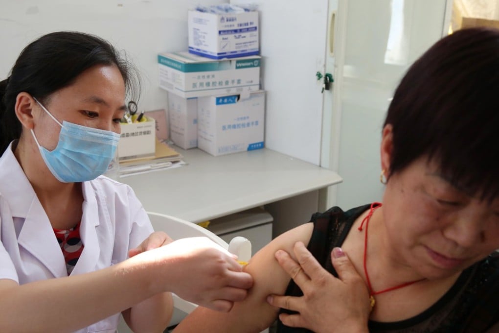 A woman receives a vaccination shot against rabies at the Disease Control and Prevention Center in Huaibei in China's eastern Anhui province on Tuesday. Photo: AFP