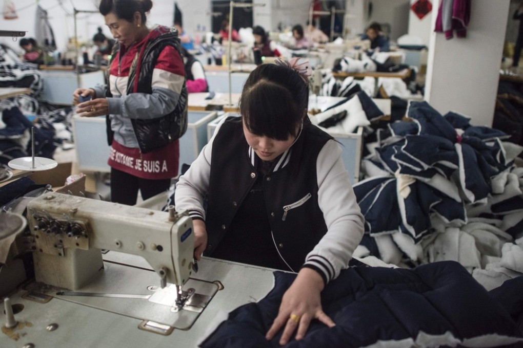Workers in a textile factory in Anxin, Hebei province on April 5, 2017. Photo: AFP