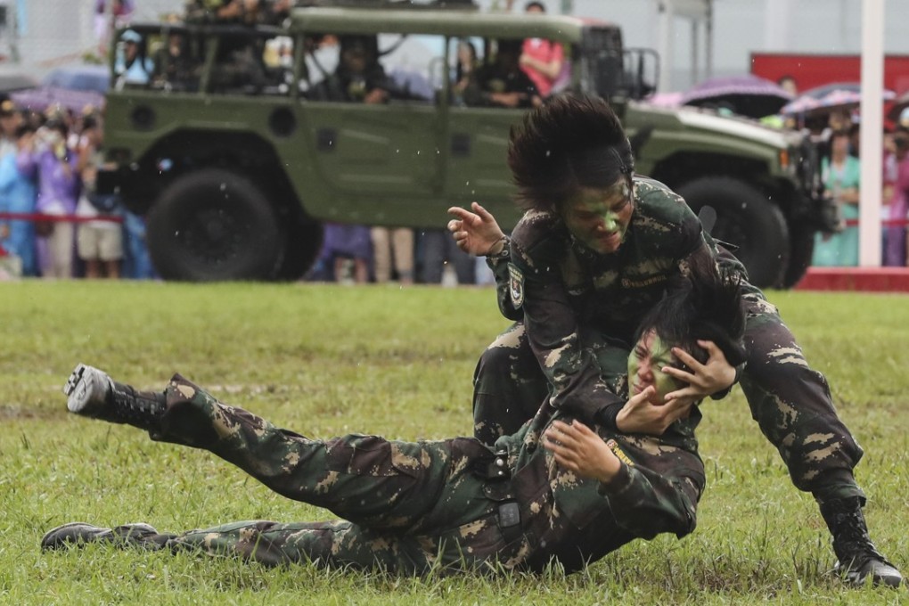 PLA soldiers perform for the public during an open day. Photo: Edward Wong