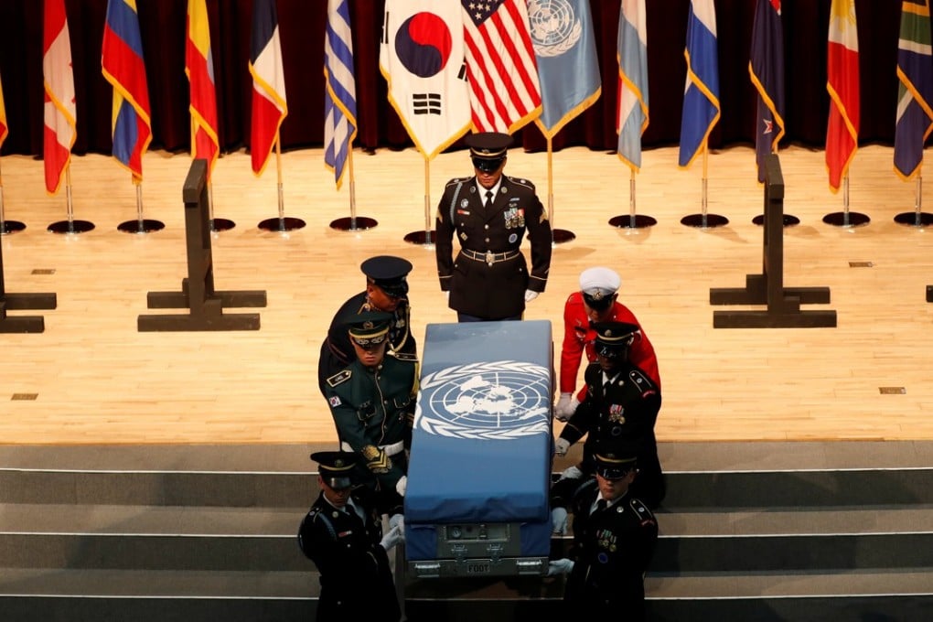 South Korean and United Nations Command (UNC) honour guards carry the remains of a United Nations Command soldier killed in North Korea in the 1950-53 Korean war during the mutual repatriation ceremony of soldiers' remains between South Korean and US at the Seoul National Cemetery in Seoul, on July 13. Photo: Reuters