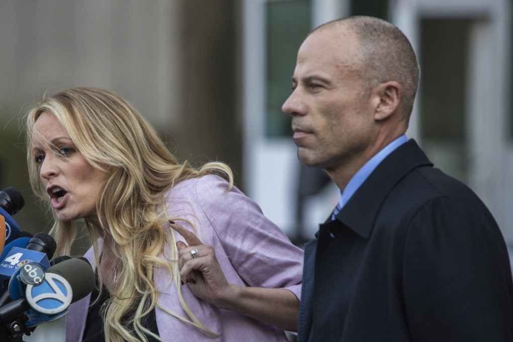 Adult-film actress Stormy Daniels (left) speaks to members of the media while attorney Michael Avenatti listens outside Federal Court in New York on April 16. Photo: Bloomberg