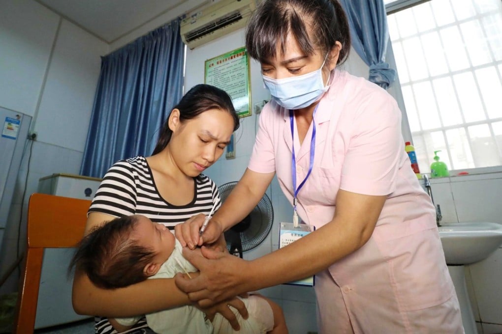 A child receives a vaccine at a hospital in Rongan, China. Thousands of DPT vaccines, which are used to inoculate children against pertussis, diphtheria, and tetanus were found ineffective. Photo: EPA