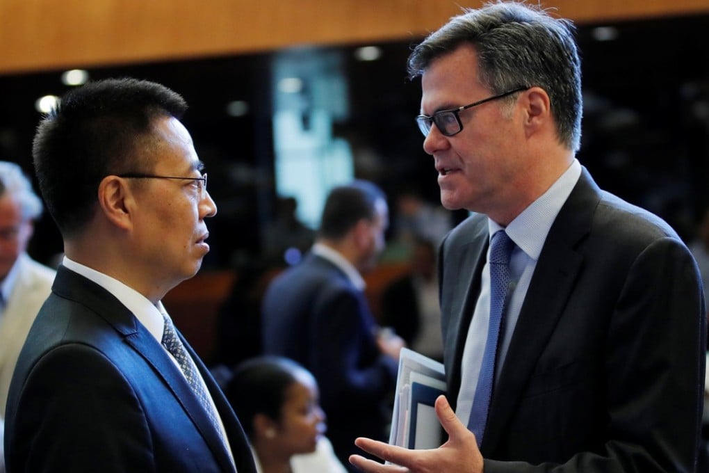 Dennis Shea (right), US Ambassador to the WTO, talks with Chinese counterpart Zhang Xiangchen before a meeting in Geneva, Switzerland, on Thursday. Photo: Reuters