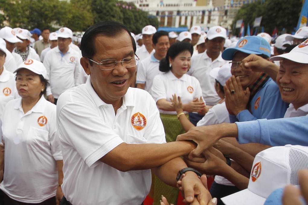 Cambodian Prime Minister Hun Sen greets supporters in Phnom Penh. Photo: AP