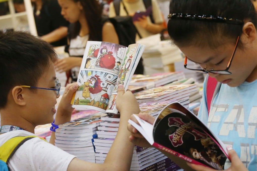 Children make a beeline for comic books on the first day of the Hong Kong Book Fair in 2016, at the Convention and Exhibition Centre that July. Photo: K.Y. Cheng