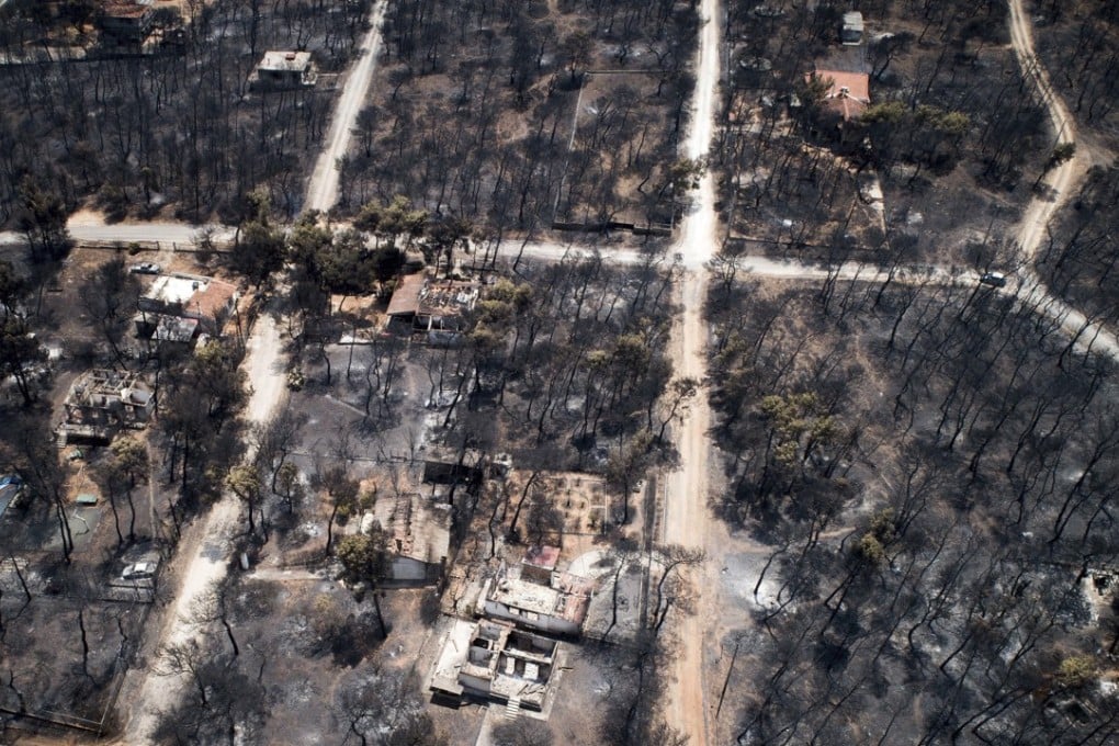 The aerial photo taken on Wednesday shows burnt houses and trees following a wildfire in Mati, east of Athens. Photo: AP