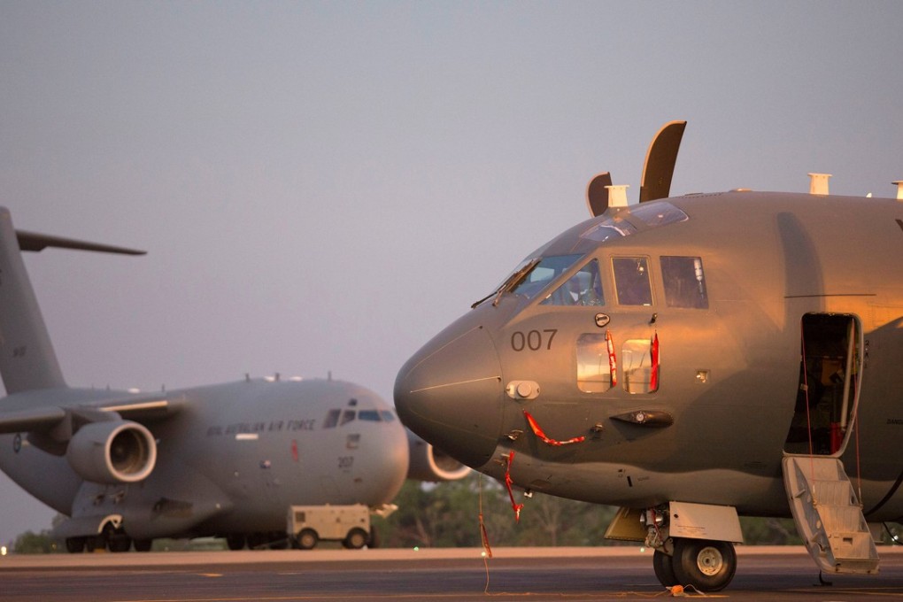 A Royal Australian Air Force C-27J Spartan next to a C-17 Globemaster III at the Royal Australian Air Force Base in Darwin, Australia on July 23, 2018. Photo: Reuters