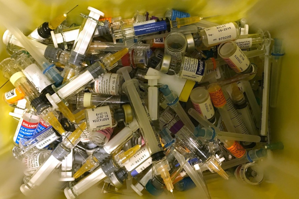 A container used for clinical waste is seen at a private clinic that performs vaccinations in Hong Kong on July 24, 2018. Hong Kong clinics said they have seen a surge in demand for children's vaccines on July 24 after a safety scandal in mainland China. Photo: AFP
