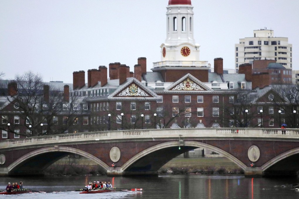Rowers paddle along the Charles River past the Harvard campus in Cambridge, Massachusetts in March last year. Photo: AP