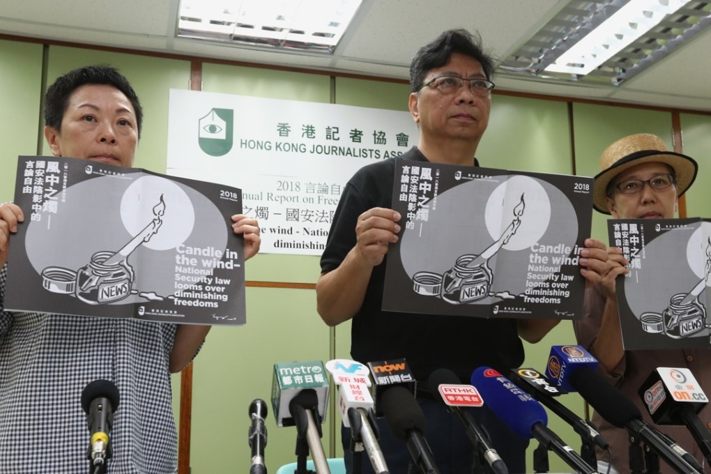 Members of the Hong Kong Journalists Association present the report. Photo: Nora Tam