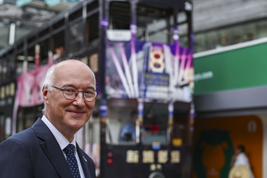 Eric Berti, consul general of France in Hong Kong and Macau, stands at a tram stop. The iconic Hong Kong trams are owned by a French company. Photo: Nora Tam