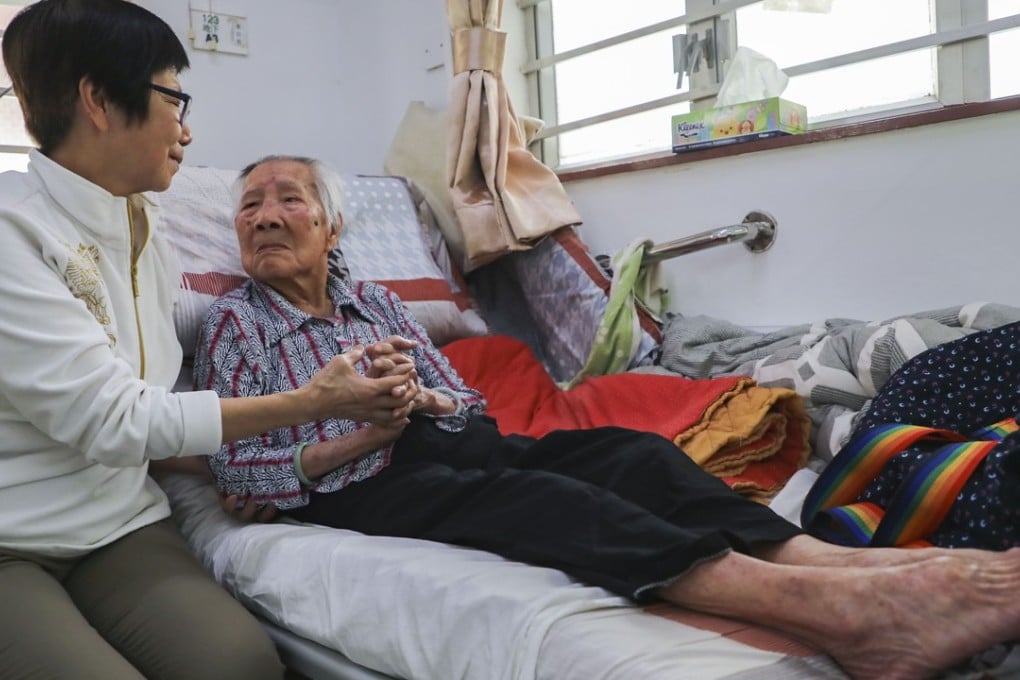 A woman visits her elderly mother in a care home in Tuen Mun. The demand for elderly care in Hong Kong outstrips the supply of affordable care options, and “ageing in place”, where elderly people live in their own homes, is seen as a solution. Photo: Edward Wong