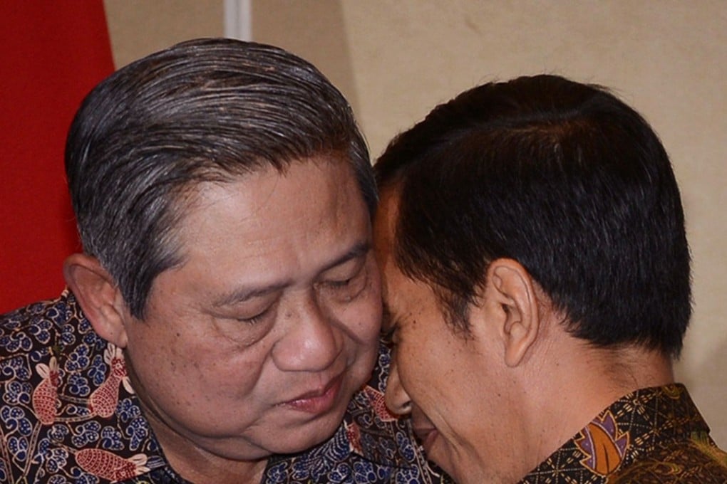 Susilo Bambang Yudhoyono and Joko Widodo embrace in 2014. Yudhoyono, who served as president from 2004 to 2014, has had a shaky relationship with his successor. File photo: AFP