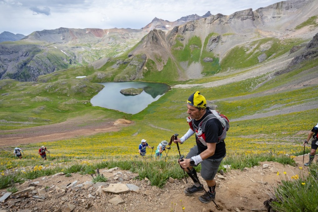 Dima Feinhaus runs the Hardrock 100 in the sunshine, but the weather turned late in the race. Photo: Paul Nelson