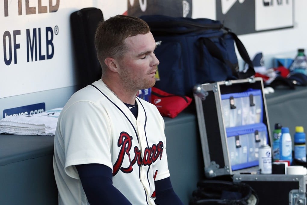 Atlanta Braves starting pitcher Sean Newcomb sits on the bench after losing his bid for a no-hitter in the ninth inning of a game against the Los Angeles Dodgers. Photo: AP