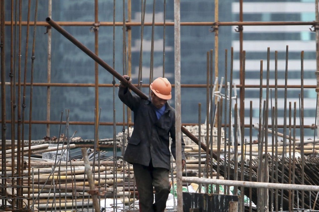 A worker on a construction site in Shanghai, China. Photo: AP