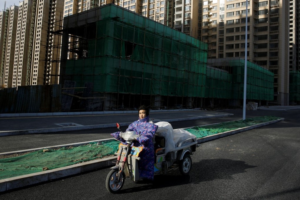 Under construction apartment blocks on the outskirts of Beijing. Developments in far-flung areas – such as most of the price-capped homes – are not very popular. Photo: Reuters