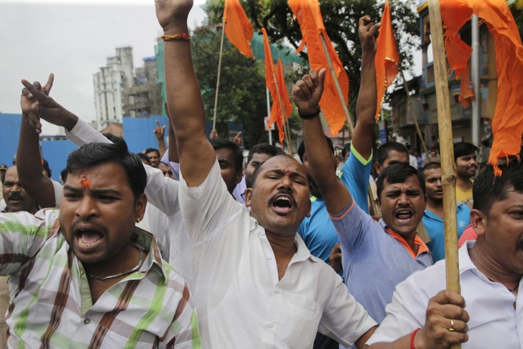 Members of the Maratha community members protesting on Wednesday in Mumbai, India. They are demanding quotas in government jobs and education. Photo: AP