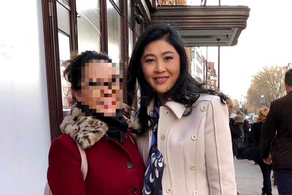 Former Thai prime minister Yingluck Shinawatra poses with a woman outside Harrods in London. Photo: Twitter/@zenjournalist