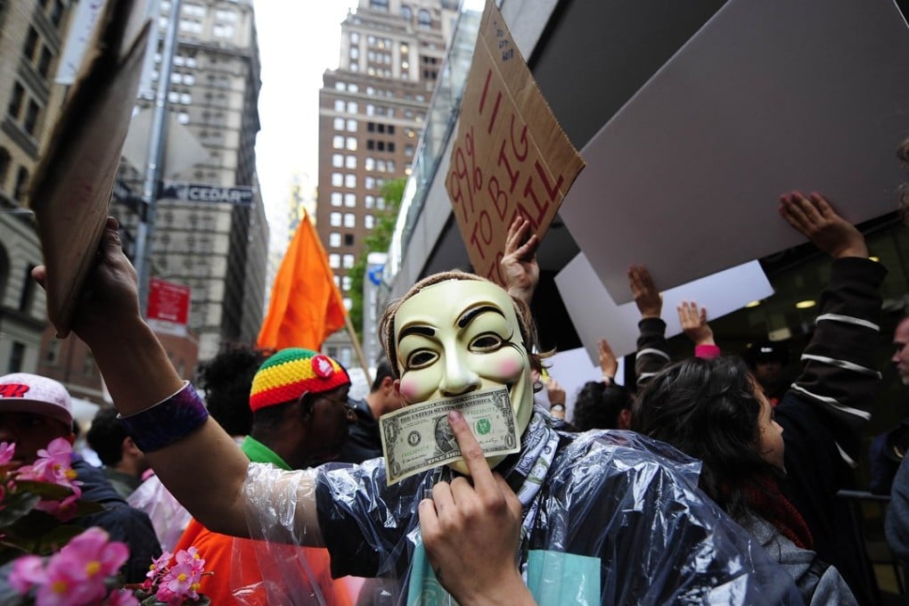 Members of the Occupy Wall Street movement stage a protest march near Wall Street in New York on October 12, 2011. The Federal Reserve’s quantitative easing programme, instituted after the 2008 financial crisis, increased income inequality. Photo: AFP