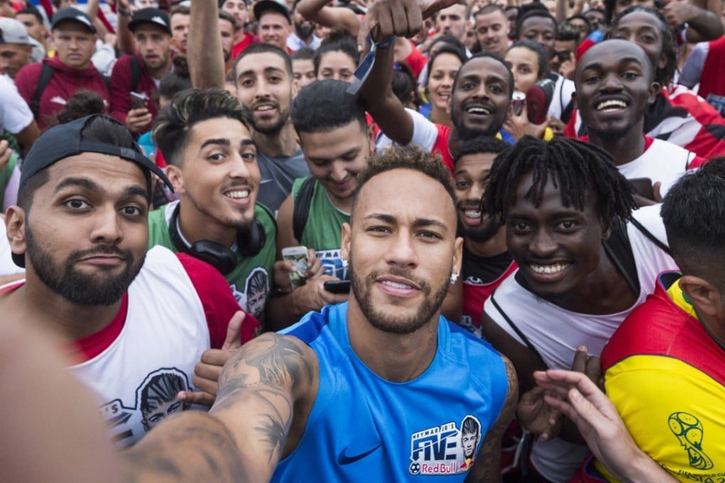 Neymar takes a selfie with players and fans at the Red Bull Neymar Jnr 5s in Instituto Projecto Neymar Jnr, Praia Grande, Brazil. Photos: Red Bull
