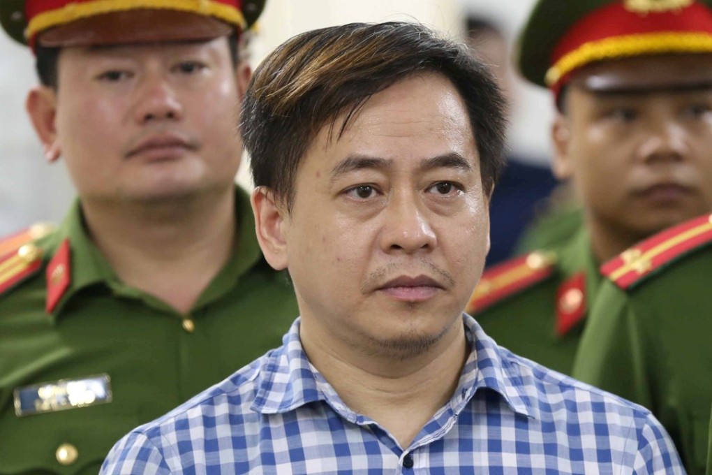 Phan Van Anh Vu listens as his verdict is read on Monday in Hanoi. He was convicted of ‘divulging state secrets’. Photo: Doan Tan/VNA via Reuters