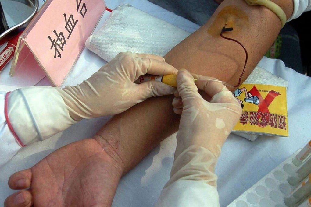 A man gets a free HIV test during a World Aids Day public awareness campaign, at a park in Fuzhou, Fujian province, China. Photo: AFP