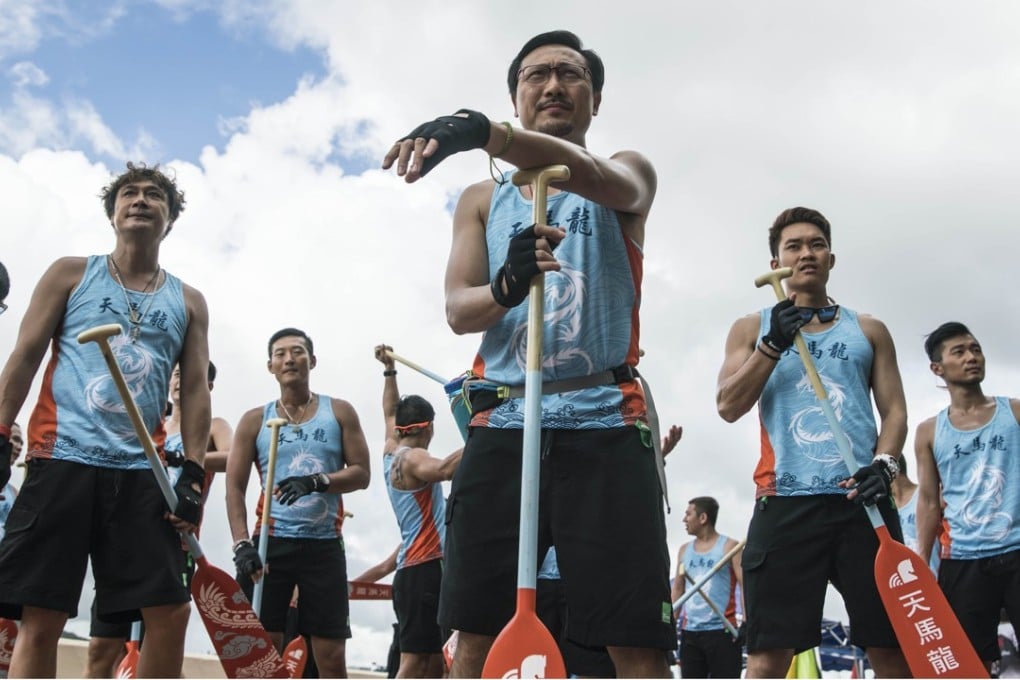 Kenny Wong (far left), Francis Ng (second left), Poon Chan-leung (centre) and Tony Wu (third right) in a scene from Men on the Dragon (category: IIB, Cantonese), directed by Sunny Chan.