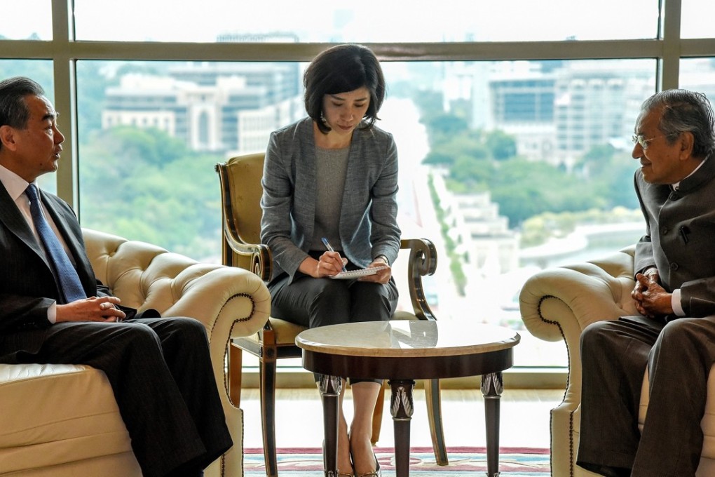 Chinese Foreign Minister Wang Yi with Malaysian Prime Minister Mahathir Mohamad in Putrajaya. Photo: AFP