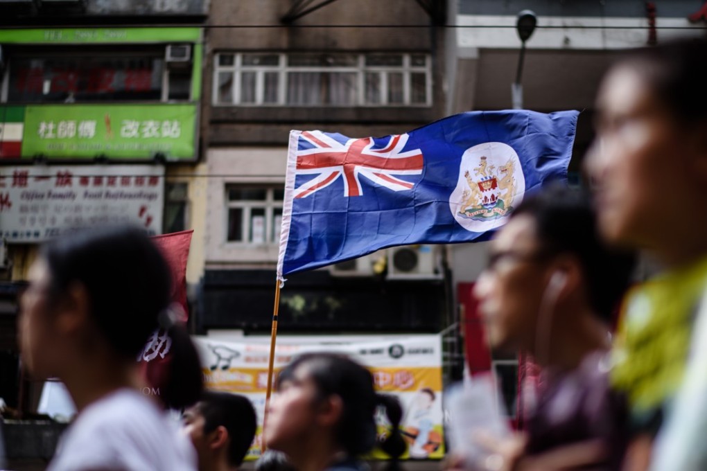 The British colonial flag is held up during a protest march in Hong Kong on July 1, 2017, the 20th anniversary of the city’s return to Chinese sovereignty. Photo: AFP