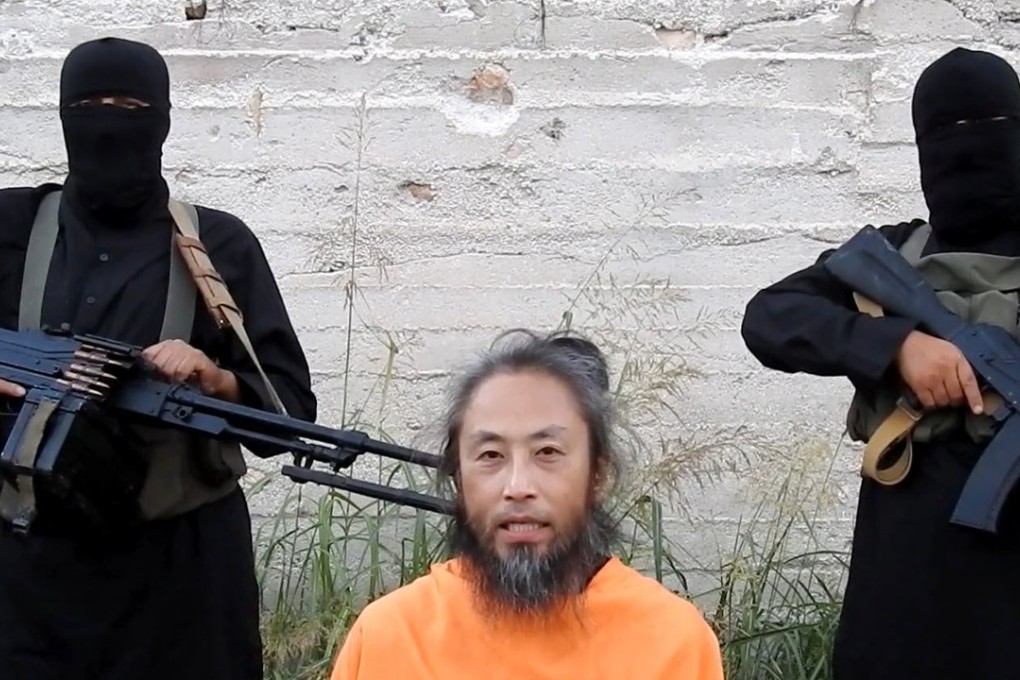 A still image captured from a video uploaded online shows a man believed to be Japanese journalist Jumpei Yasuda, who went missing in Syria in 2015, asking for help. Photo: Kyodo