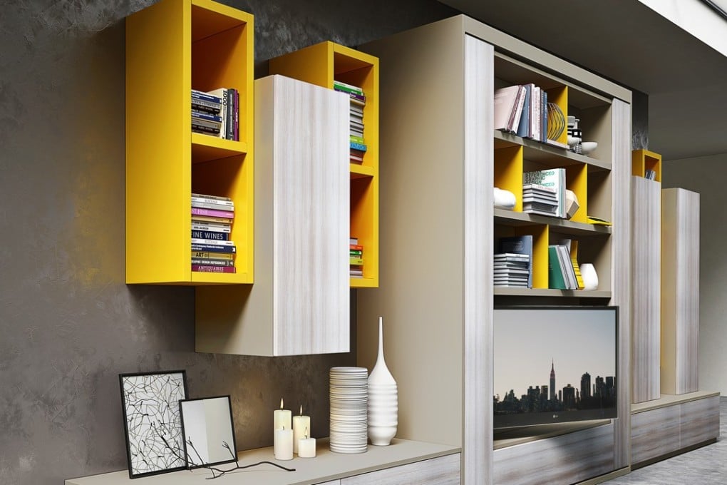 A multifunctional system from Singapore company Spaceman that houses a bed behind a revolving TV unit.