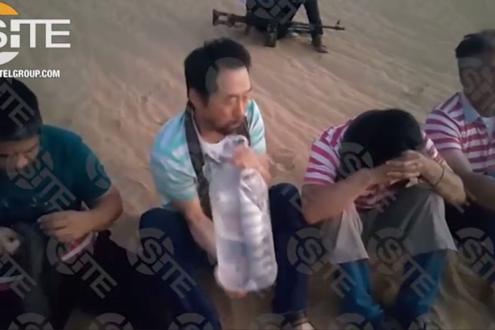The four hostage This screen grab image taken from video released on August 1, 2018 and provided courtesy of the SITE Intelligence Group shows four hostages, one from South Korea and three from the Philippines, who are foreign employees of an engineering company in Tripoli.