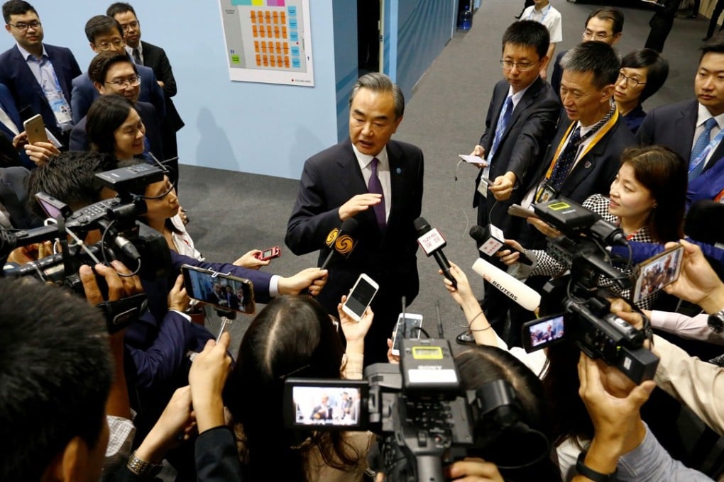 China’s Foreign Minister Wang Yi speaks to reporters after meetings on the sidelines of the Asean Foreign Ministers’ Meeting in Singapore on Friday. Photo: Reuters