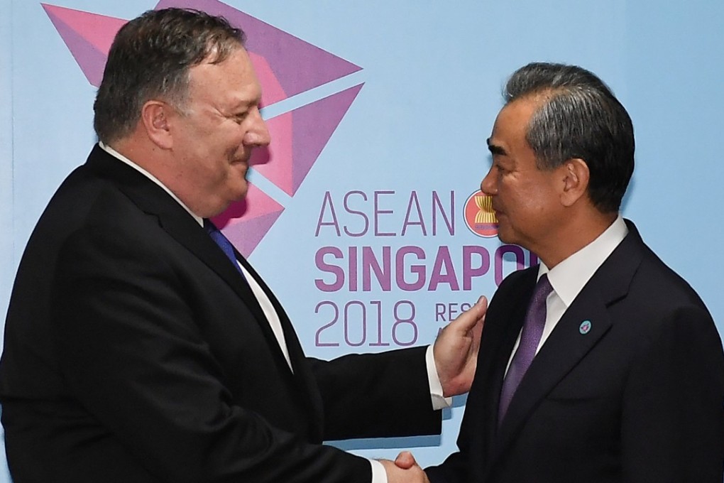 US Secretary of State Mike Pompeo and China's Foreign Minister Wang Yi shake hands before their bilateral meeting at the 51st Association of Southeast Asian Nations in Singapore. Photo: Reuters