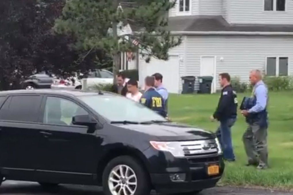 After a search of Xiaoqing Zheng’s home in Niskayuna, New York, FBI agents said they retrieved a passport showing five trips to China in the past two years.