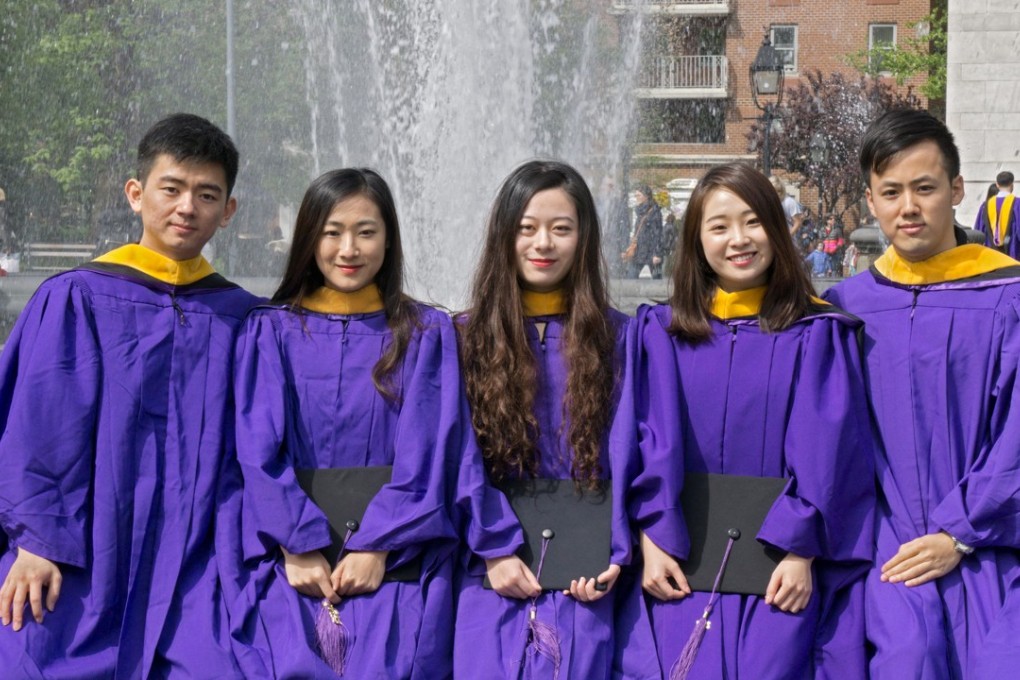 Chinese students from New York University pose in their graduation gowns at Washington Square Park, in Manhattan in October 2017. Photo: Alamy
