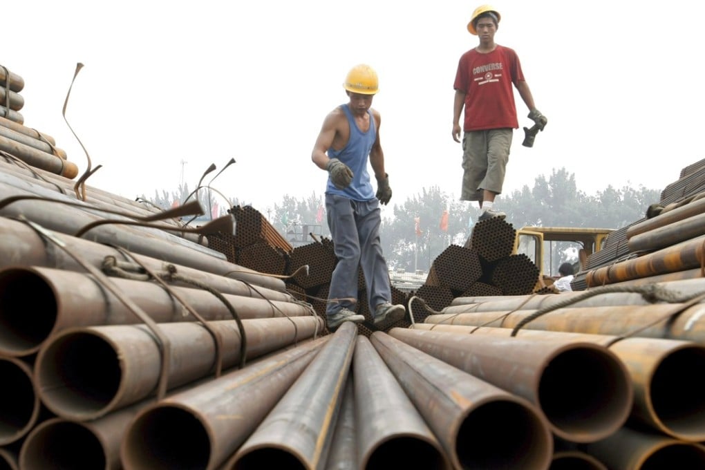Workers at a steelyard in Beijing. China is Australia’s largest trading partner. Photo: EPA