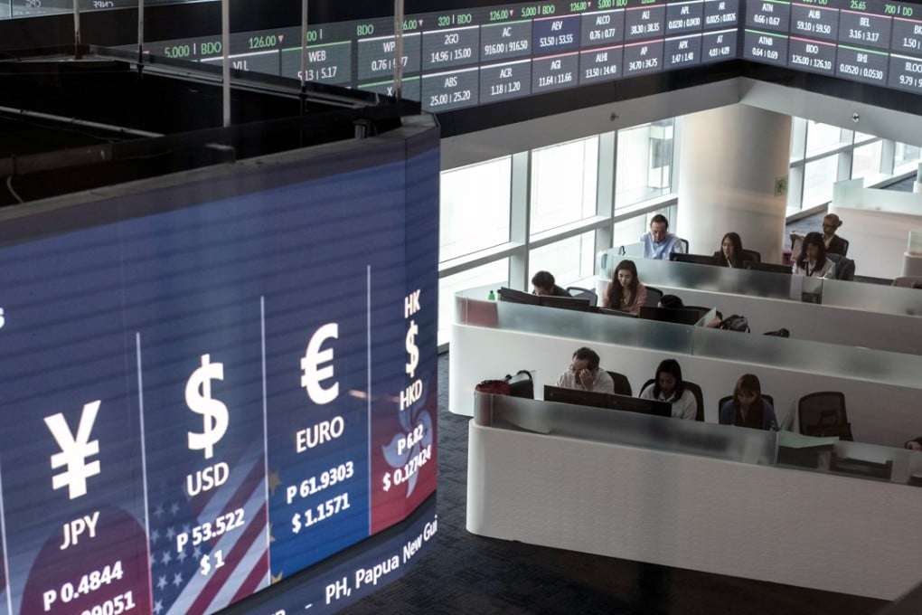 Foreign exchange rates on the trading floor of the Philippine Stock Exchange. Photo: Bloomberg