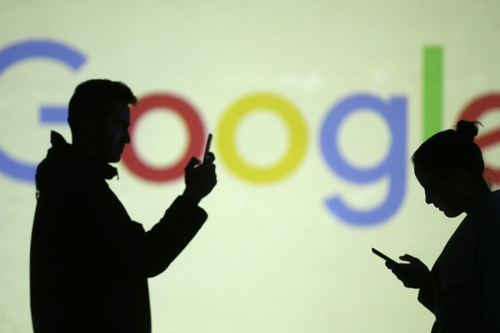Silhouettes of mobile users are seen next to a screen projection of Google logo in this picture illustration taken March 28, 2018. Photo: Reuters