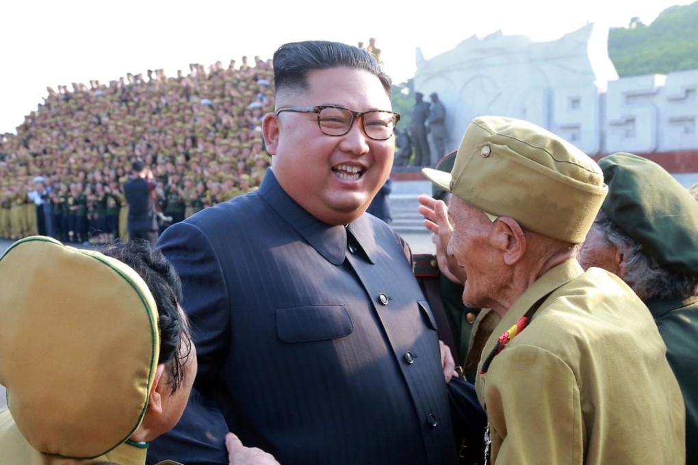 In this July 26, 2018, photo, provided on July 27, by the North Korean government, North Korean leader Kim Jong Un, center, is greeted by the participants of a war veterans' meeting, on the 65th anniversary of the signing of the ceasefire armistice that ends the fighting in the Korean War, in Pyongyang. Independent journalists were not given access to cover the event depicted in this image distributed by the North Korean government. The content of this image is as provided and cannot be independently verified. Korean language watermark on image as provided by source reads: "KCNA" which is the abbreviation for Korean Central News Agency. (Korean Central News Agency/Korea News Service via AP)