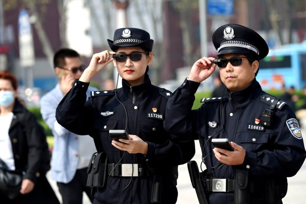 Police officers display their AI-powered smart glasses in Luoyang, Henan province. Photo: Reuters