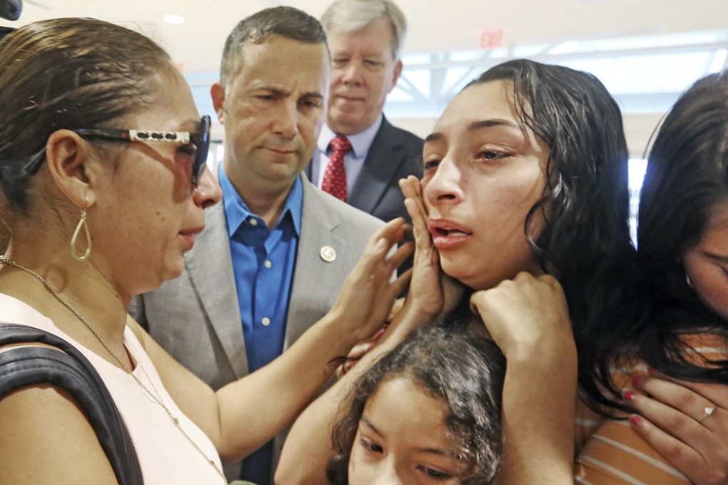 Alejandra Juarez, left, saying goodbye to her children, Pamela, 16, and Estela, 9, at Orlando International Airport on Friday. Photo: AP
