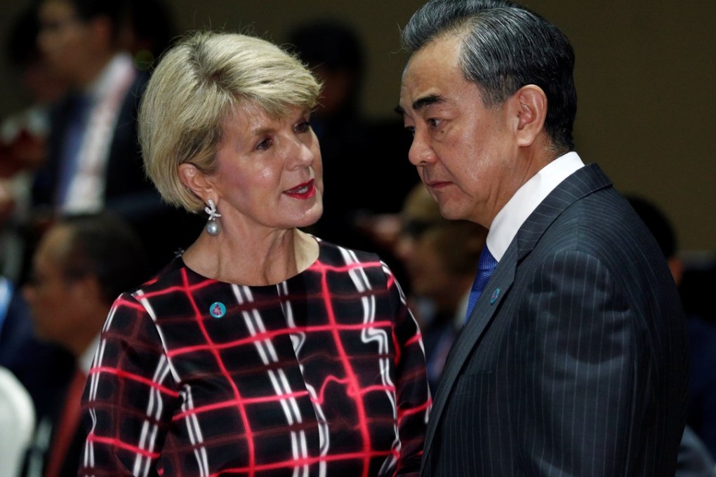 Australian Foreign Minister Julie Bishop meets her Chinese counterpart Wang Yi at the East Asia Summit Foreign Ministers’ Meeting in Singapore on Saturday. Photo: Reuters