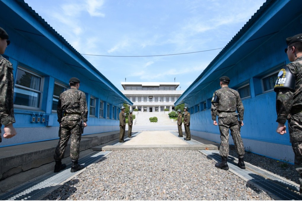 North Korean soldiers stand guard at the joint security area in the demilitarised zone in Panmunjom. China could take a greater role in peace talks. Photo: EPA-EFE